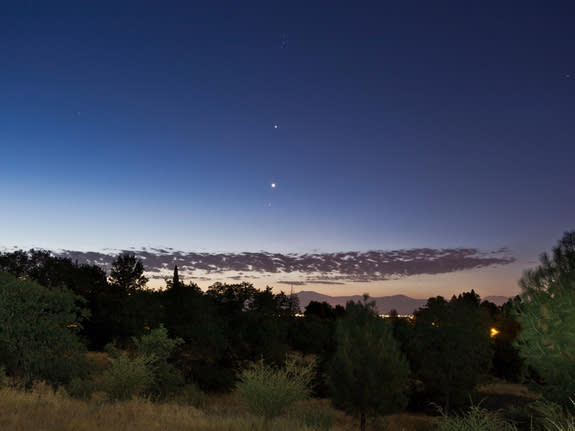 Skywatcher Cory Poole sent this photo of Jupiter and Venus seen from Redding, CA, on July 5, 2012. Poole writes: "You can see Venus passing through the Hyades open star cluster with Jupiter and the Pleiades above that. The foreground was illum