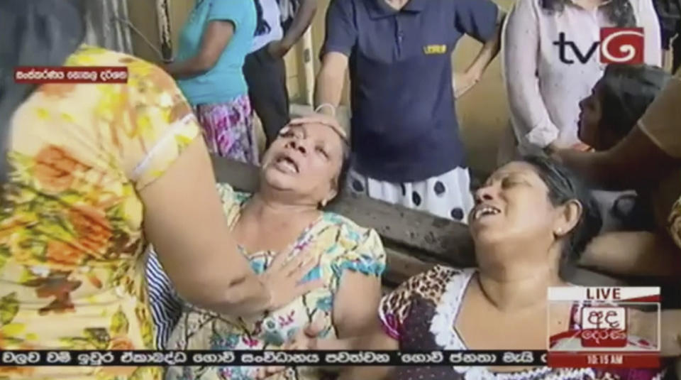 This image made from video released by Derena TV shows women in despair after an explosion in Colombo. Source: AAP/AP