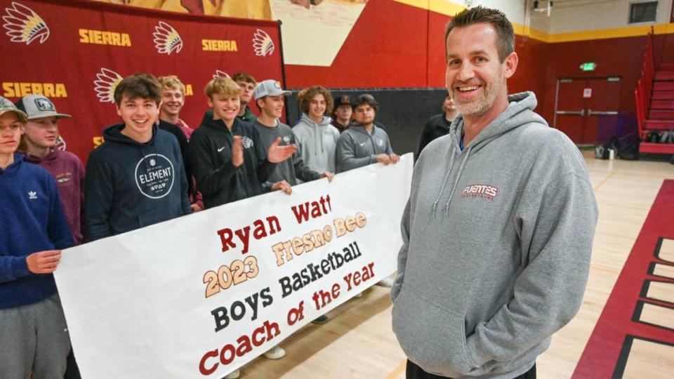 Sierra High School boys basketball coach Ryan Watt is surprised by his players with a banner after being named The Fresno Bee’s boys high school basketball Coach of the Year. CRAIG KOHLRUSS/ckohlruss@fresnobee.com