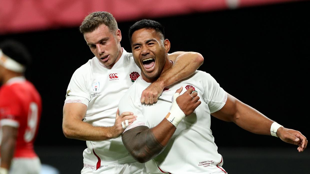  Manu Tuilagi (R) celebrates with team mate George Ford after scoring his second try during the previous Rugby World Cup 