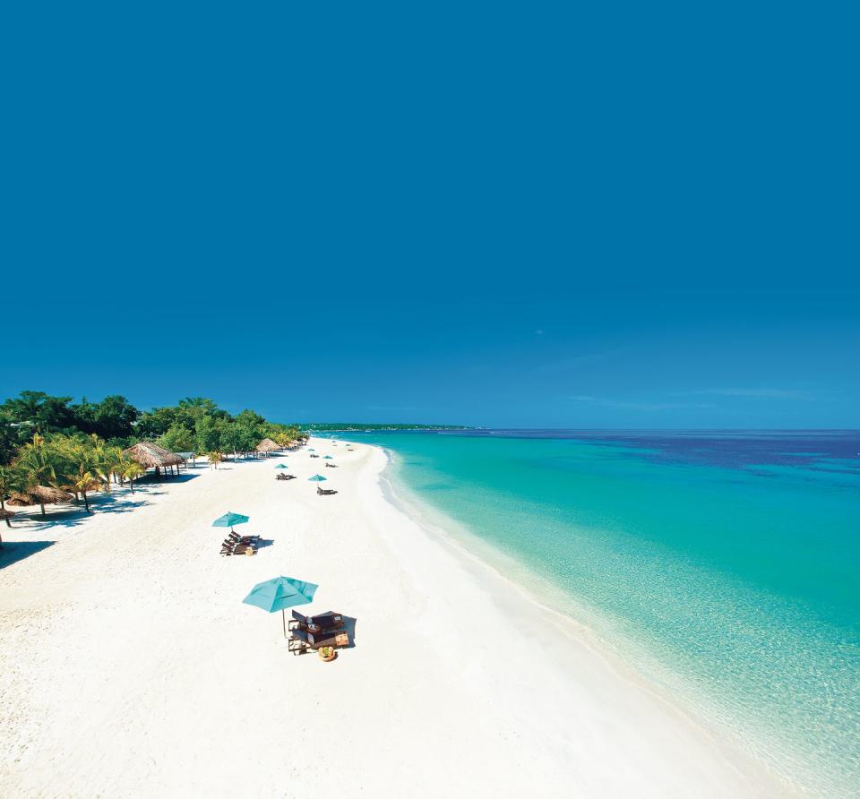 a sparsely attended white sand beach at beaches negril, a good housekeeping pick for best family vacation destinations