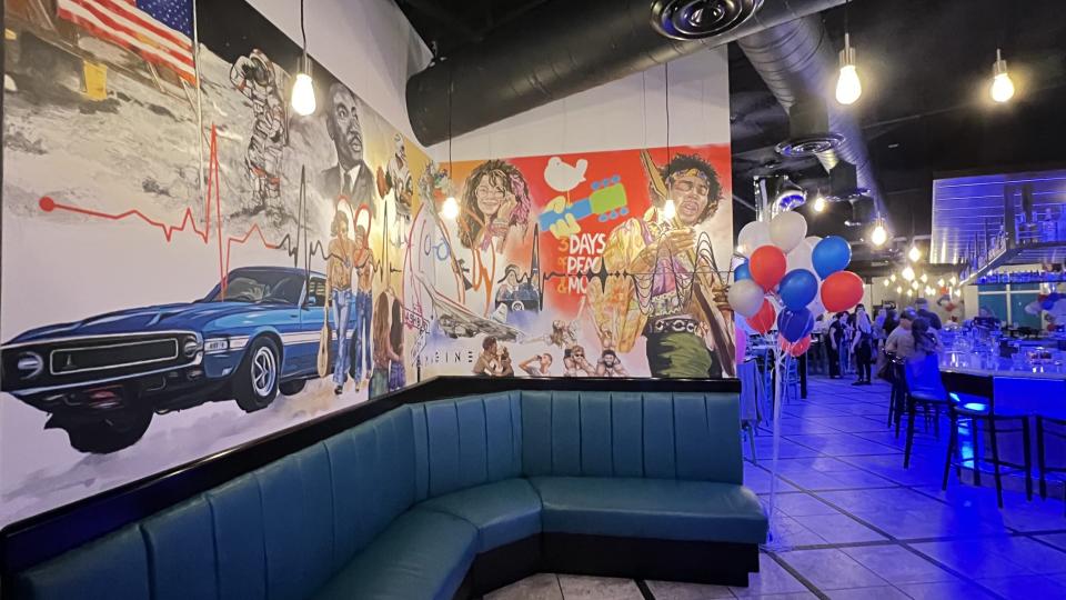 At Cirque69 American Gastropub in Jensen Beach, the dining room has a calm vibe, retro pendants and wavy chandeliers hanging from the dark ceiling. Guitars are suspended above a long teal blue banquette on a glass wall behind which, the kitchen was humming.