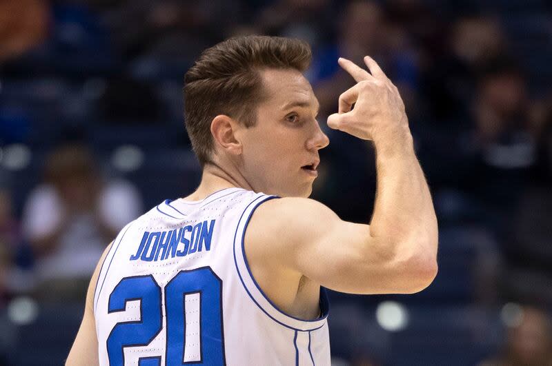 BYU guard Spencer Johnson holds up three fingers after making a 3-pointer in victory over San Diego State at BYU’s Marriott Center in Provo on Friday, Nov. 10, 2023.
