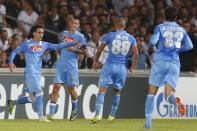 Napoli's Jose Callejon (L) celebrates with team mates after scoring the first goal for the team during their Champions League soccer match against Olympique Marseille at the Velodrome stadium in Marseille, October 22, 2013. REUTERS/Jean-Paul Pelissier (FRANCE - Tags: SPORT SOCCER)
