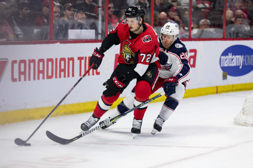 OTTAWA, ON - APRIL 06: Ottawa Senators Defenceman Thomas Chabot (72) protects the puck from Columbus Blue Jackets Winger Riley Nash (20) during third period National Hockey League action between the Columbus Blue Jackets and Ottawa Senators on April 6, 2019, at Canadian Tire Centre in Ottawa, ON, Canada. (Photo by Richard A. Whittaker/Icon Sportswire via Getty Images)