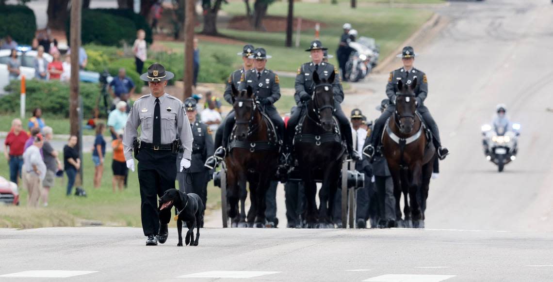 Slain Wake County Sheriffs Deputy Ned Byrds K9 partner, Sasha, leads the N.C. State Highway Patrols Caisson Unit during a procession for Deputy Byrd before his funeral at Providence Baptist Church in Raleigh, N.C., Friday, August 19, 2022.