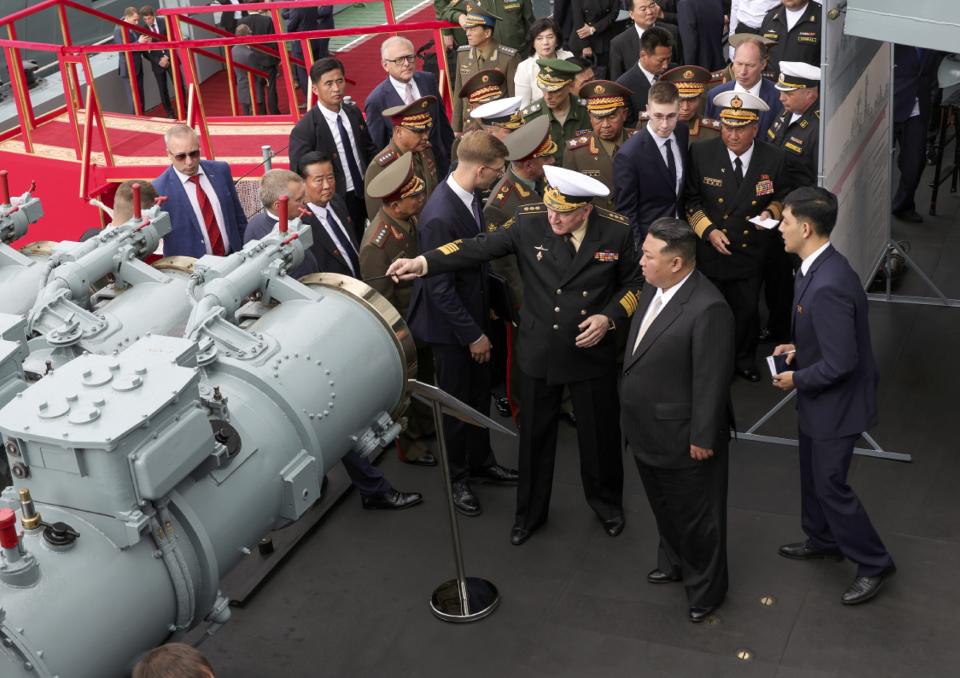 In this photo released by Russian Defense Ministry Press Service on Saturday, Sept. 16, 2023, North Korea's leader Kim Jong Un, foreground second right, listens to explanations by Admiral Nikolai Yevmenov, Commander-in-Chief of the Russian Navy, foreground center, while visiting the Admiral Shaposhnikov frigate of the Russian navy in the port of Vladivostok, Russian Far East. The visit was part of Kim's trip across Russia's Far East that has featured talks with Russian President Vlaidmir Putin and sparked Western concerns about an arms deal between the two old allies.(Russian Defense Ministry Press Service via AP)