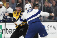Boston Bruins' Chris Wagner (14) fights with Tampa Bay Lightning's Barclay Goodrow during the first period of an NHL hockey game Saturday, March 7, 2020, in Boston. (AP Photo/Winslow Townson)