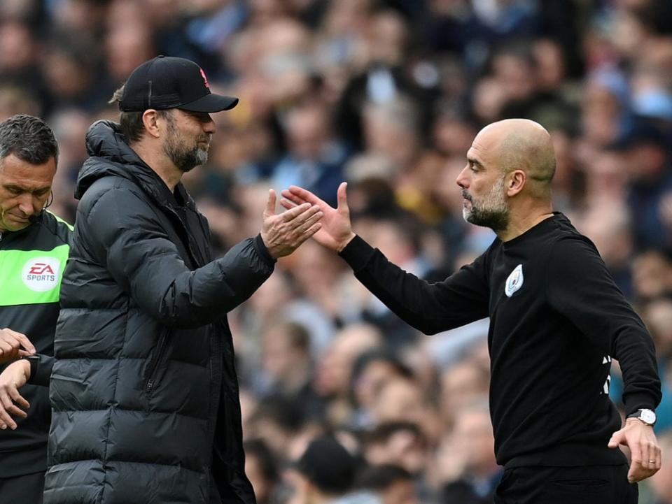 Klopp’s Liverpool can still pip Guardiola’s City on the final day (Getty Images)