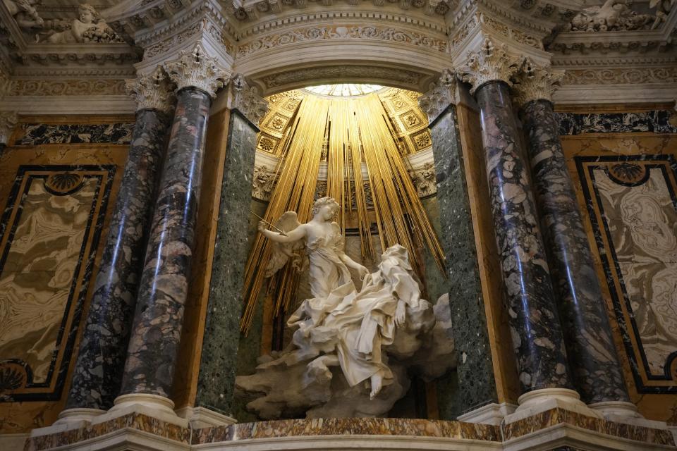 A view of the Ecstasy of Saint Teresa, the central sculptural marble group in the Cornaro Chapel during the presentation of its restoration in Santa Maria Della Vittoria Church, in Rome, Thursday, Oct. 21, 2021. The restoration involved the entire chapel, a masterpiece of the High Roman Baroque, designed and completed by Gian Lorenzo Bernini in 1653. (AP Photo/Alessandra Tarantino)