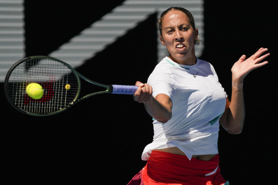 Madison Keys of the U.S. plays a forehand return to Paula Badosa of Spain during their fourth round match at the Australian Open tennis championships in Melbourne, Australia, Sunday, Jan. 23, 2022. (AP Photo/Simon Baker)