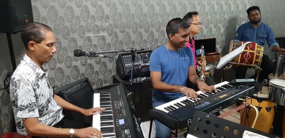 Sanjiv (middle) rocking out with his friends at the Music Mart music school. — Picture courtesy of Aseana Percussion Unit