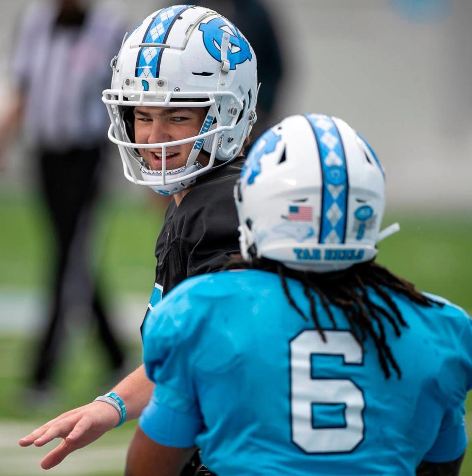 North Carolina quarterback Drake Maye (10) congratulates wide receiver Nate McCollum (6) after a pass reception for a touchdown during the Tar Heels’ open practice on Saturday, March 25, 2023 at Kenan Stadium in Chapel Hill. N.C.