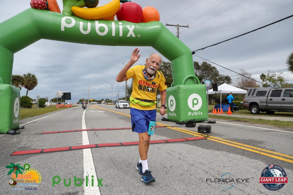 Bob Sielski crosses the finish line during the 2022 Publix Florida Marathon in February near Front Street Park in downtown Melbourne. Then 79, he was the oldest runner in the event, finishing in 6 hours, 52 minutes.