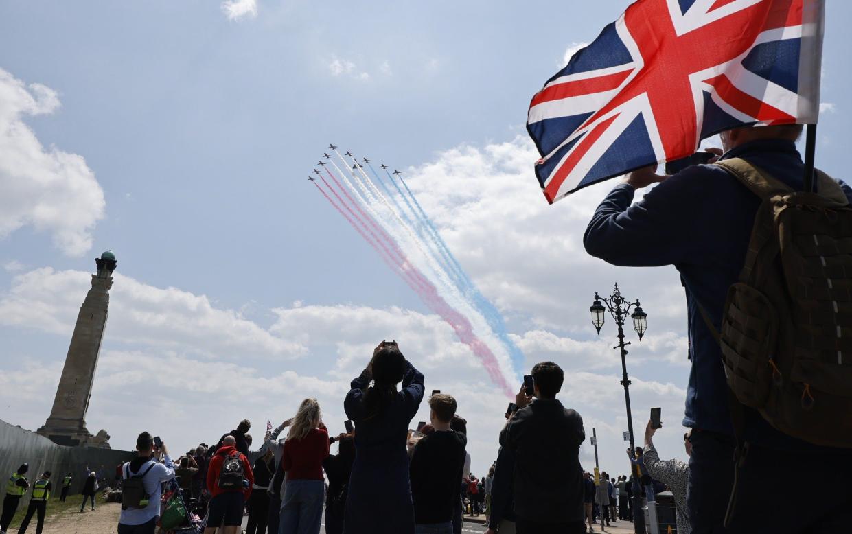 The Red Arrows fly over the D-Day 80th Anniversary event at Southsea Common in Portsmouth