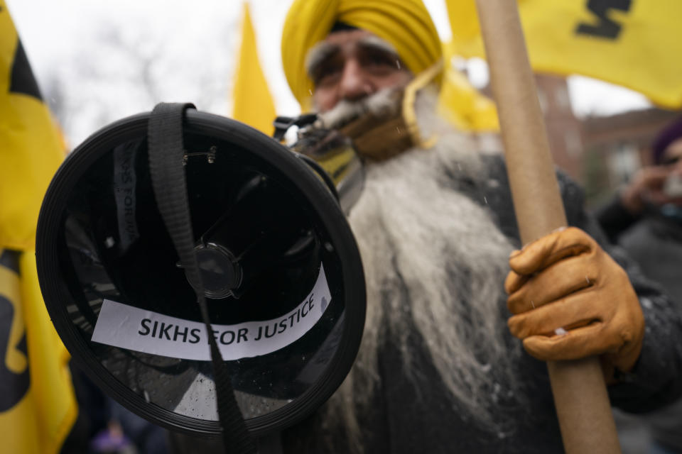 Protesters gather outside the Consulate General of India, Tuesday, Jan. 26, 2021, in the Manhattan borough of New York. Tens of thousands of protesting farmers have marched, rode horses and drove long lines of tractors into India's capital, breaking through police barricades to storm the historic Red Fort. The farmers have been demanding the withdrawal of new laws that they say will favor large corporate farms and devastate the earnings of smaller scale farmers. Republic Day marks the anniversary of the adoption of India’s constitution on Jan. 26, 1950. (AP Photo/John Minchillo)