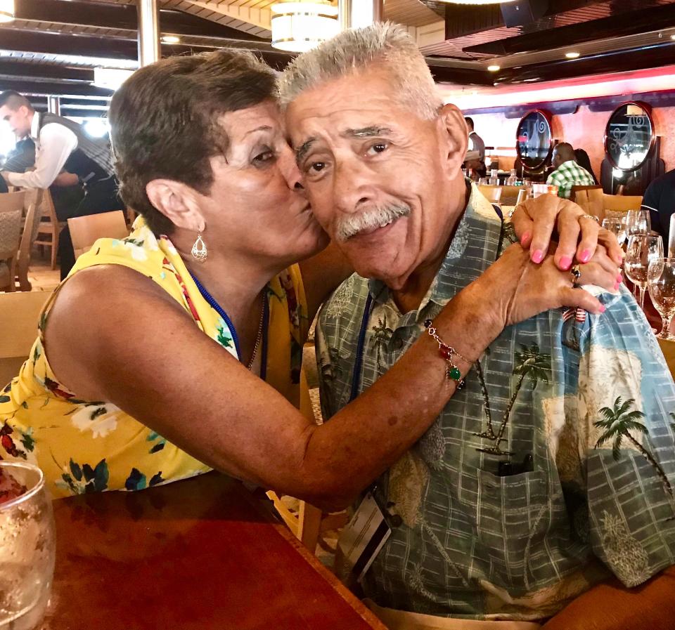 The parents of Engagement Editor John Torres during a 2019 cruise. Carmen Torres (left) kissing John's dad, Rick Torres.