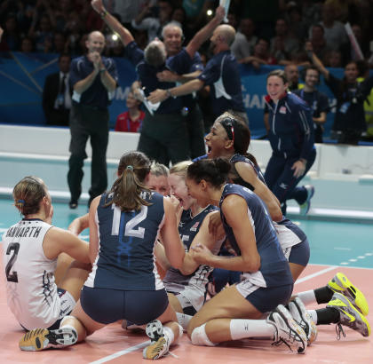 United States&#39; team celebrates after winning the women&#39;s Volleyball World Championships final match against China in Milan, Italy, Sunday, Oct. 12, 2014. (AP Photo/Emilio Andreoli)