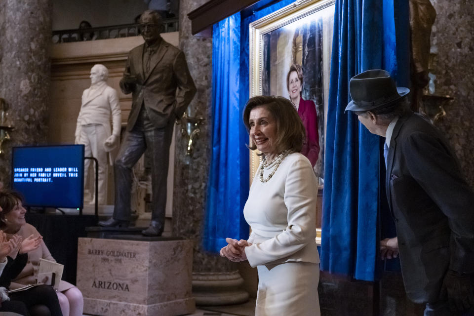 Speaker of the House Nancy Pelosi, D-Calif., is joined by her husband Paul Pelosi as they attend her portrait unveiling ceremony in Statuary Hall at the Capitol in Washington, Wednesday, Dec. 14, 2022. (AP Photo/J. Scott Applewhite)