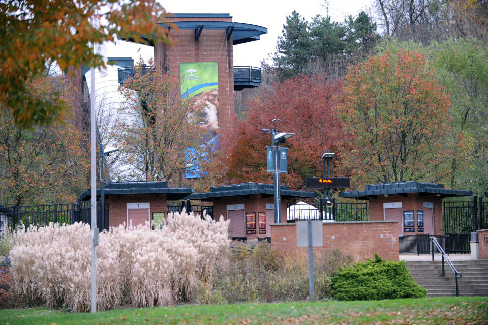This photo taken Sunday, Nov. 4, 2012 shows the exterior view of the front entrance of the Pittsburgh Zoo, where zoo officials say a young boy was killed after he fell into the exhibit that was home to a pack of African painted dogs, who pounced on the boy and mauled him. It’s not clear whether he died from the fall or the attack, said Barbara Baker, president and CEO of the Pittsburgh Zoo & PPG Aquarium. (AP Photo/John Heller)