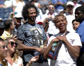 Colin Kaepernick reacts after watching Naomi Osaka, of Japan, defeat Magda Linette, of Poland during the second round of the US Open tennis championships Thursday, Aug. 29, 2019, in New York. (AP Photo/Eduardo Munoz Alvarez)