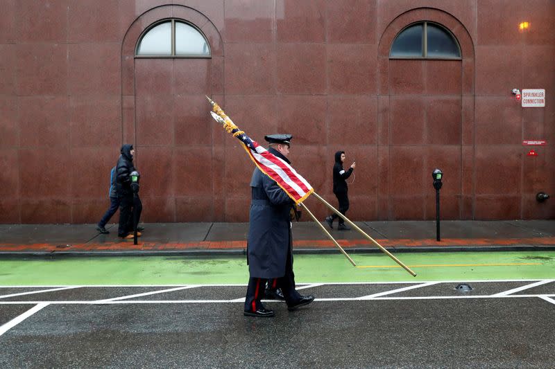 Police officers carry flags ahead of funeral service for Jersey City Police Detective Joseph Seals in Jersey City