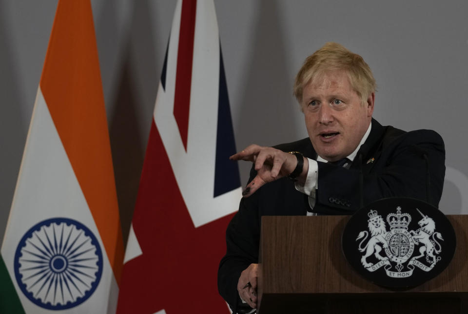 British Prime Minister Boris Johnson addresses a press conference in New Delhi, Friday, April 22, 2022. Johnson told reporters that India had come out strongly against the killings in Bucha earlier this month. The British prime minister also said "he (Indian Prime Minister Narendra Modi) has already intervened several times with Vladimir Putin to ask him what on Earth he is doing and where it is going." (AP Photo/Manish Swarup)