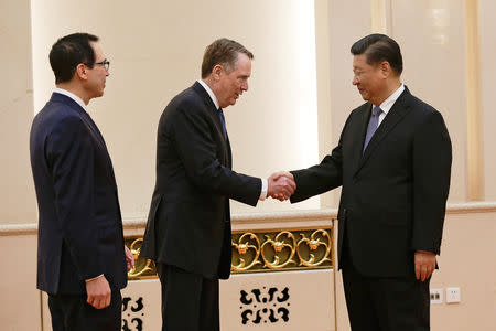 U.S. Trade Representative Robert Lighthizer shakes hands with Chinese President Xi Jinping next to U.S. Treasury Secretary Steven Mnuchin before proceeding to their meeting at the Great Hall of the People in Beijing, China February 15, 2019. Andy Wong/Pool via REUTERS