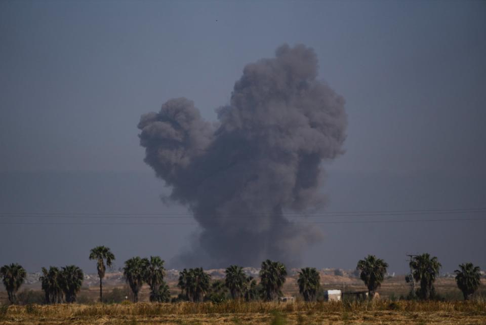 Smoke rises to the sky after an explosion in Gaza Strip, as seen from southern Israel on April 4, 2024.