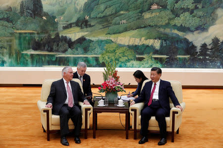 U.S. Secretary of State Rex Tillerson (L) meets with Chinese President Xi Jinping (R) during a meeting at the Great Hall of the People in Beijing, China September 30, 2017. REUTERS/Andy Wong/Pool