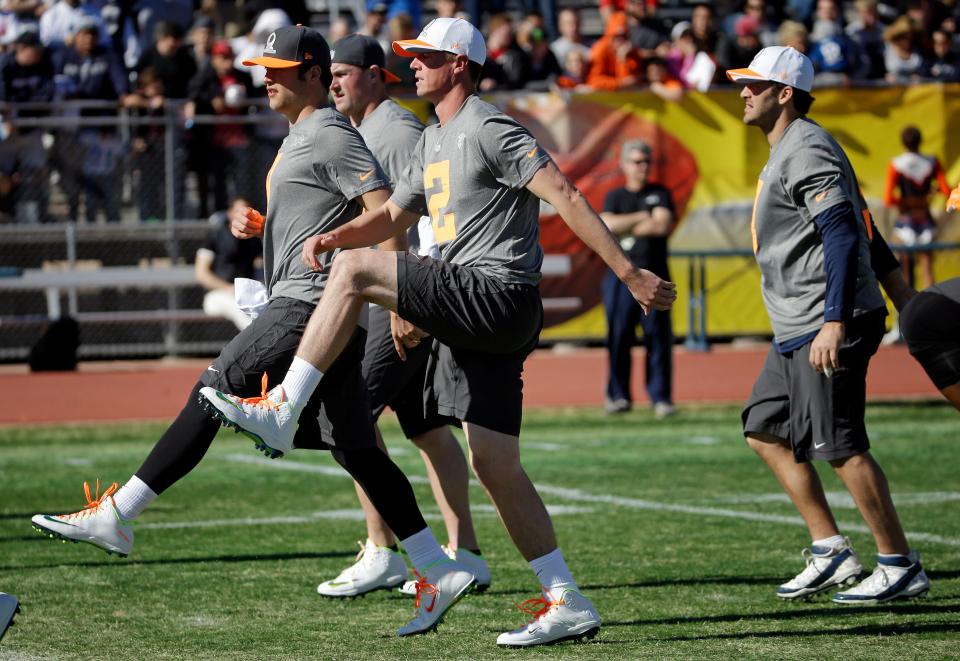 Atlanta Falcons quarterback Matt Ryan, right, and Detroit Lions quarterback Matthew Stafford warm up during practice for the Pro Bowl on Jan. 24, 2015, in Scottsdale, Ariz.