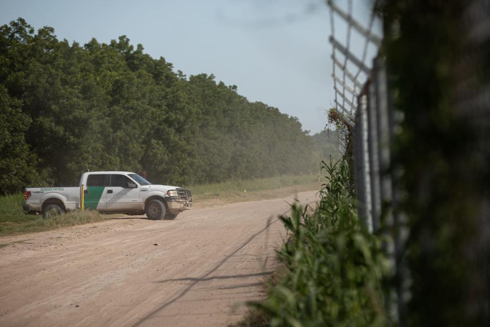 Border Patrol pulls out of a Heavenly Farms pecan grove on July 20 in Eagle Pass, Texas. The agency leases a section of the property from owners Hugo and Magali Urbina.