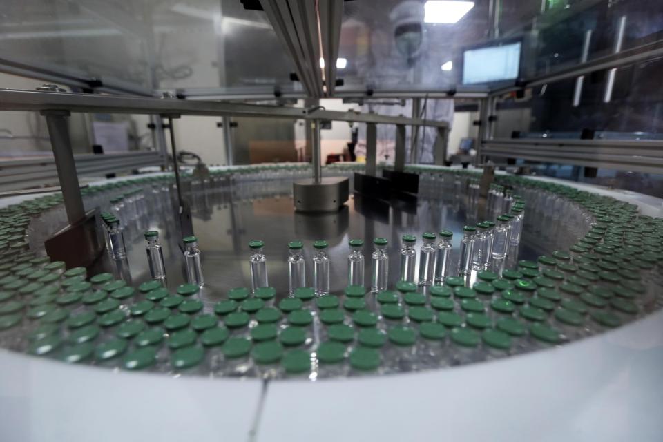 Vials of AstraZeneca vaccines are placed to be packaged inside a laboratory at Serum Institute of India, in Pune, India, Thursday, Jan. 21, 2021. The world's largest vaccine maker, based in India, will be able to restart exports of AstraZeneca doses by June if new coronavirus infections subside in the country, its chief executive said Tuesday, April 6. The company is a key supplier for the U.N.-backed COVAX program that aims to distribute vaccines equitably in the world. On March 25, COVAX announced a major setback in its vaccine rollout because a surge in infections in India had caused the Serum Institute of India to cater to domestic demand, resulting in a delay in global shipments of up to 90 million doses. (AP Photo/Rafiq Maqbool)