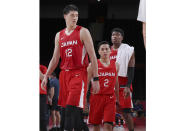 Japan's Yuki Togashi, center, with Yuta Watanabe, left, and Rui Hachimura, right, reacts after their team's loss to Slovenia, during the men's basketball first round game at the Tokyo 2020 Olympics on July 29, 2021 in Saitama. The East Asia Super League is set to launch next October featuring some of the region’s biggest domestic clubs. It’s banking on Asia’s home-grown talent to grow from an invitational event to the world’s third-biggest basketball league. One is the so-called Golden Boy of the Philippines. Another is the first 100 million-yen-a-season basketball player in Japan Togashi. (Kyodo News via AP)