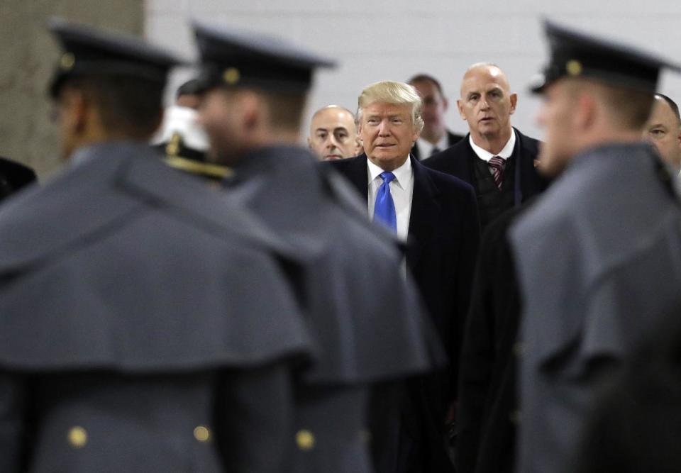 President-elect Donald Trump walks up to greet Army Cadets and Navy Midshipmen before the Army-Navy NCAA college football game in Baltimore, Saturday, Dec. 10, 2016. (AP Photo/Patrick Semansky)