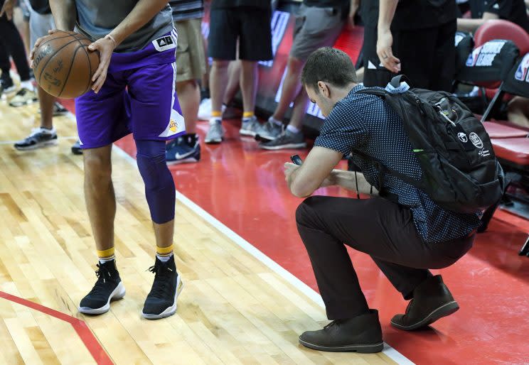 A photographer takes pictures of Lonzo Ball's sneakers. This is all part of the plan. (Getty Images)