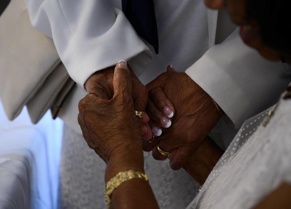 Barbara Holman-Robinson holds hands with friend Dr. Carolyn O’Neil during her 105th birthday celebration with family members and friends at Leatherby’s Family Creamery on Monday, July 15, 2019 in Sacramento.