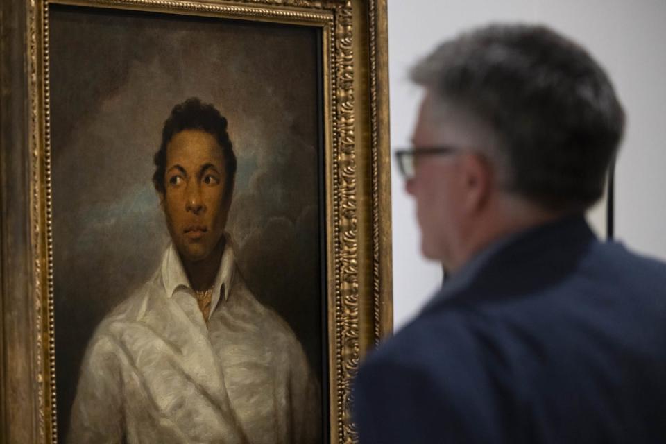 A visitor looks at a portrait of Ira Aldridge at the Herbert Art Gallery & Museum in Coventry, on loan from the National Portrait Gallery (PA)