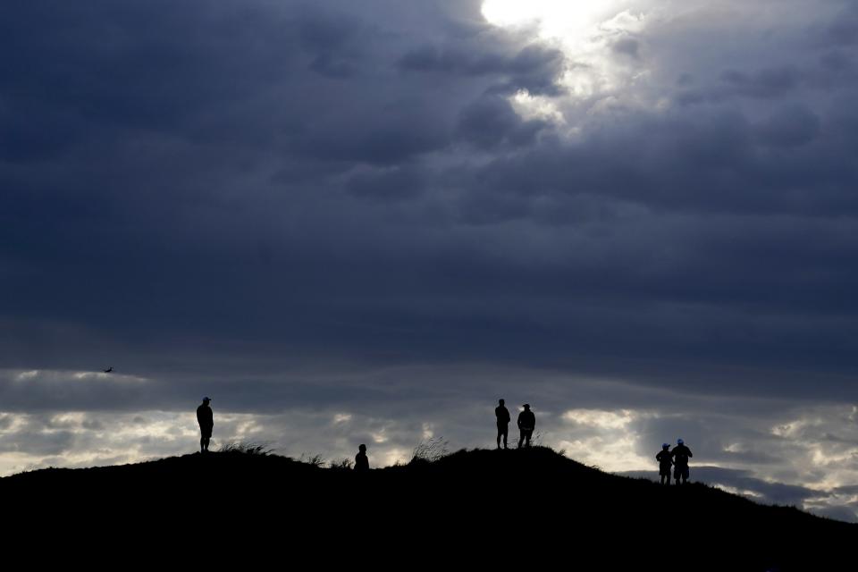 Fans overlook the 14th green during a four-ball match the Ryder Cup at the Whistling Straits Golf Course Friday, Sept. 24, 2021, in Sheboygan, Wis. (AP Photo/Charlie Neibergall)