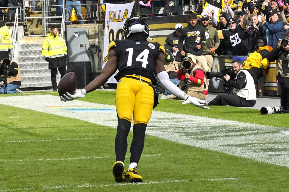 Pittsburgh Steelers wide receiver George Pickens (14) celebrates in the end zone after scoring on a 41-yard pass play from quarterback Kenny Pickett during the second half of an NFL football game against the Baltimore Ravens in Pittsburgh, Sunday, Oct. 8, 2023. (AP Photo/Gene J. Puskar)