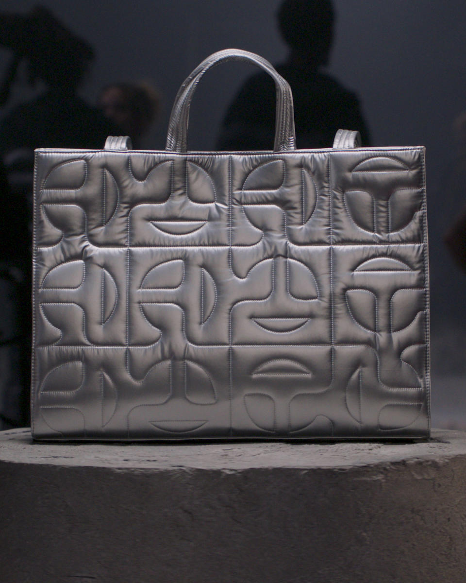 The large portrait silver quilted Moose Knuckles x Telfar bag.