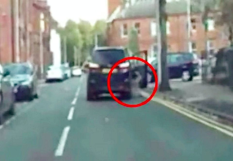 Dashcam footage shows the woman being dragged 65ft along Lodge Road in West Bromwich, West Mids. (SWNS)