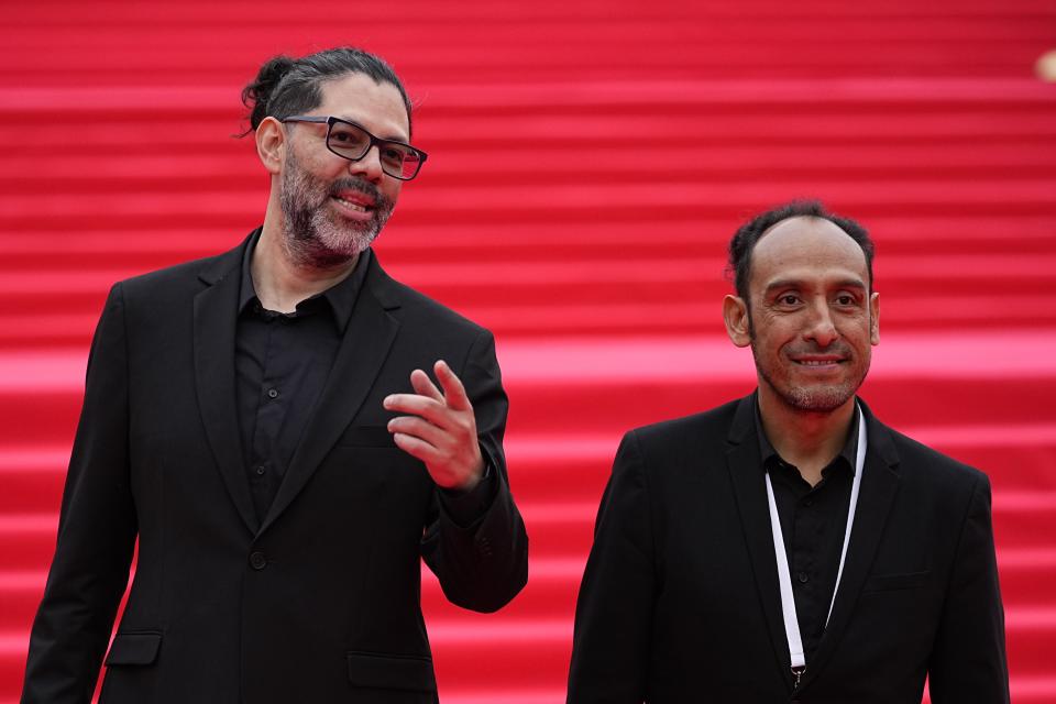 Mexican director Miguel Salgado, right, and Alfredo Mendoza, actor and screenwriter, pose for a photo as they arrive at the closing ceremony of the 46th Moscow International Film Festival in Moscow, Russia, on Friday, April 26, 2024. A Mexican film has won the top prize at the Moscow International Film Festival which took place as major Western studios boycott the Russian market and as Russia's war in Ukraine grinds into its third year. "Shame," a film by director Miguel Salgado and co-produced by Mexico and Qatar, was the most highly awarded film at the festival which began in 1935 and which has been held annually since 1999. (AP Photo/Alexander Zemlianichenko)