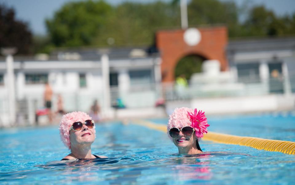 Swimmers in the London borough of Hillingdon on July 31 - Leon Neal/Getty Images