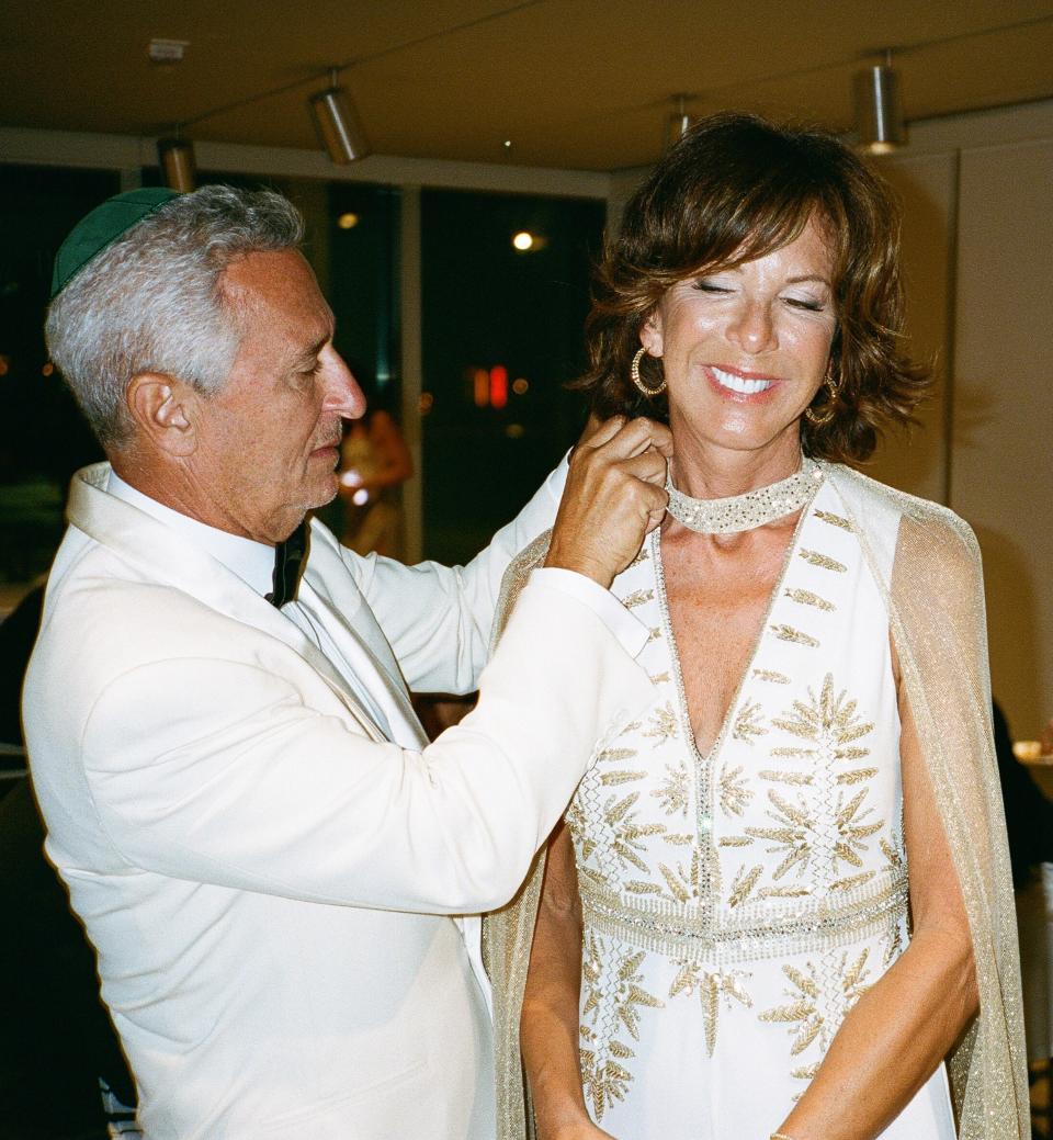 My beautiful mother getting her dress’s finishing touches by my father who has the most impeccable eye for detail.
