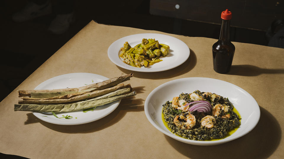 Waly-Fay’s miondo (fermented cassava sticks) gombos (okra) and ndolé (shrimp with peanuts). - Credit: Laura Stevens