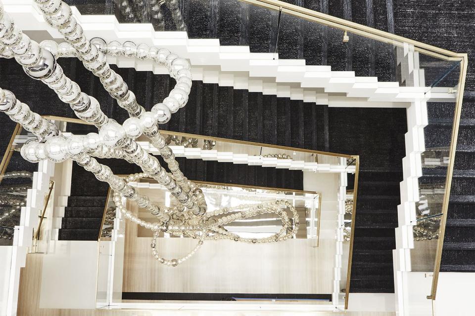 <p>The sculpture, designed by Jean-Michel Othoniel, extends down a central staircase within the store. </p>