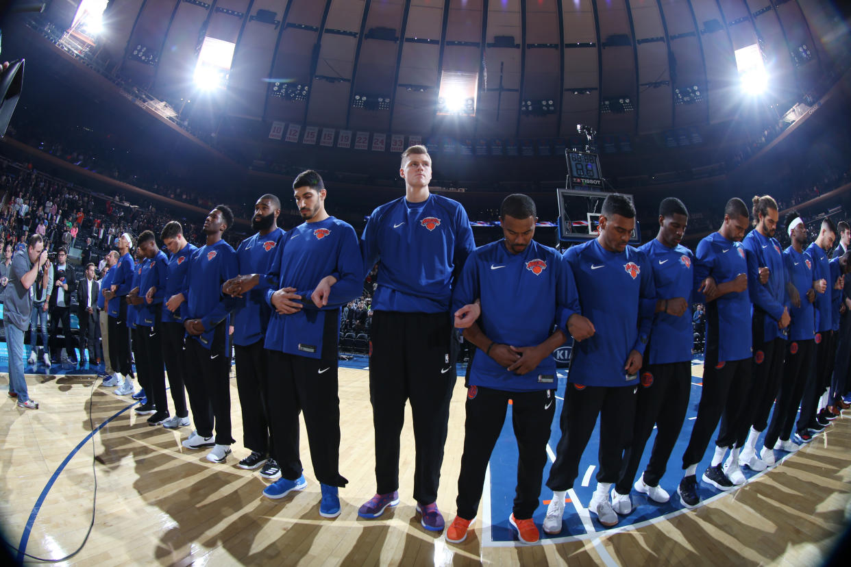 The New York Knicks stand for&nbsp;the national anthem with linked arms before a preseason game on Oct. 3, 2017. (Photo: Nathaniel S. Butler via Getty Images)