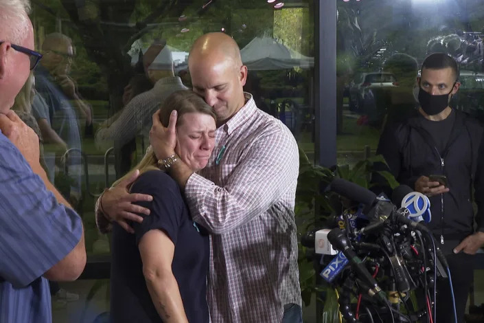 Nichole Schmidt, the mother of Gabby Petito, is comforted by her husband, Jim Schmidt, during a news conference on Sept. 28, 2021, in Bohemia, N.Y. (Ted Shaffrey / AP)