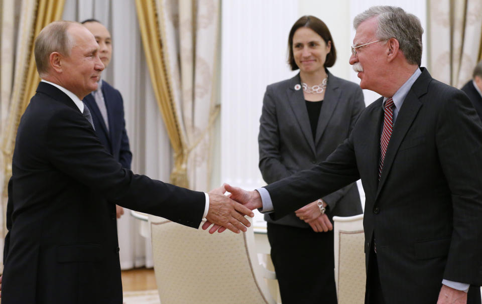 Russian President Vladimir Putin, left, shakes hands with U.S. National security adviser John Bolton during their meeting in the Kremlin in Moscow, Russia, Tuesday, Oct. 23, 2018. (AP Photo/Alexander Zemlianichenko)